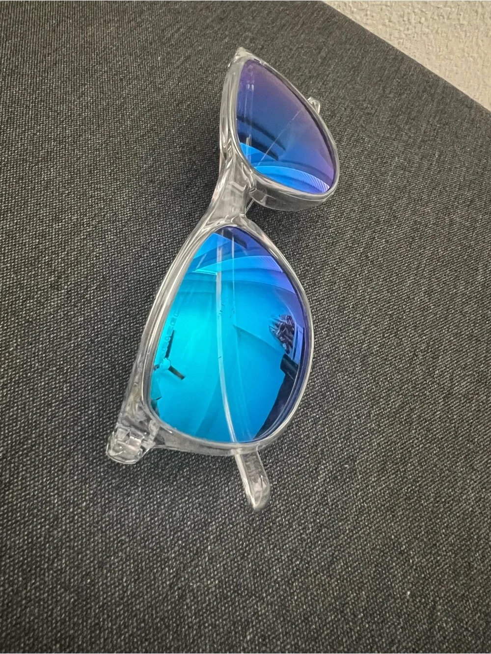 Oakley Clear Frame Sunglasses with Bright Blue Mirrored Lenses